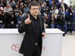 Director Mungiu attends a photo call for the film Dupa Dealuri at the 65th Cannes Film Festival